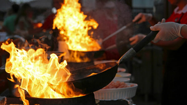 Flambe Chef Cooking in Outdoor Kitchen